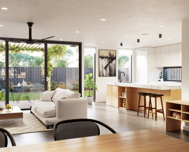 Modern open-plan living area with a kitchen, island with stools, and white sofa